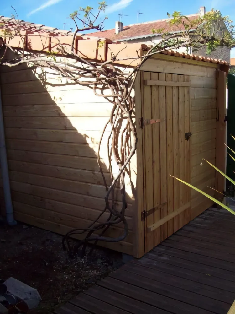 a wooden shelter is very useful for storing outdoor tools